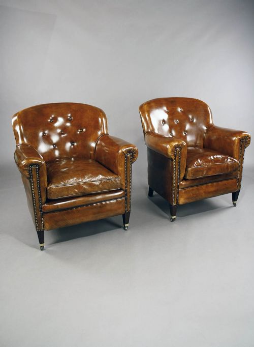 fig 2. A pair of Antique Leather Shaped Armchairs