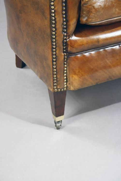 fig 3. A pair of Antique Leather Shaped Armchairs