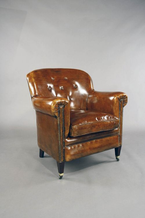fig 5. A pair of Antique Leather Shaped Armchairs