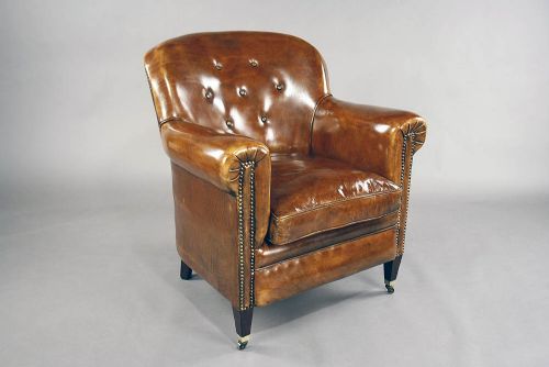 fig 6. A pair of Antique Leather Shaped Armchairs
