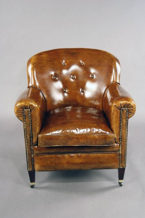 fig 7. A pair of Antique Leather Shaped Armchairs