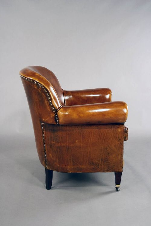 fig 9. A pair of Antique Leather Shaped Armchairs