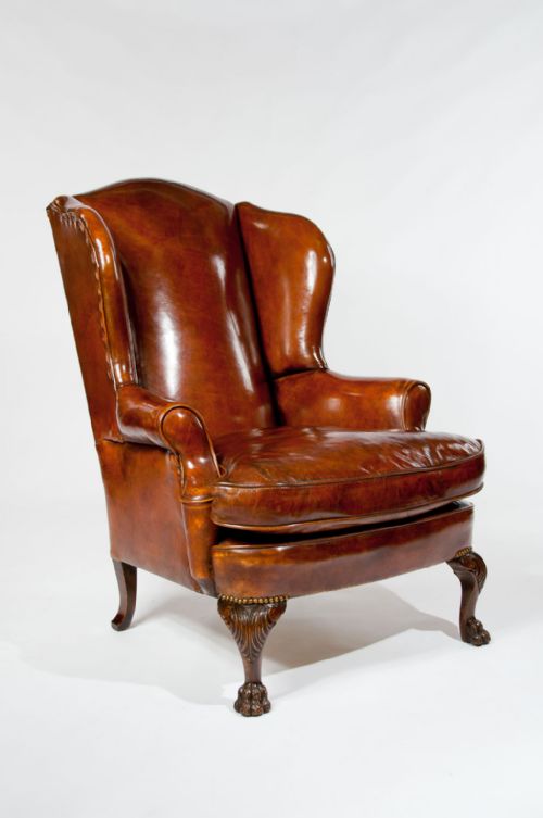 fig 1. Antique Leather Upholstered Wing Chair