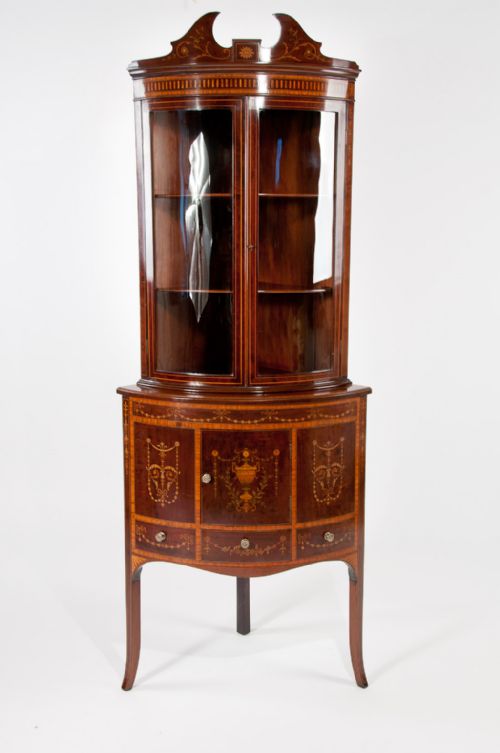 A Very Fine Bow Fronted Inlaid Corner Cabinet