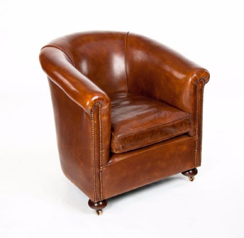 A Quality Antique Leather Tub Armchair 

 
 
