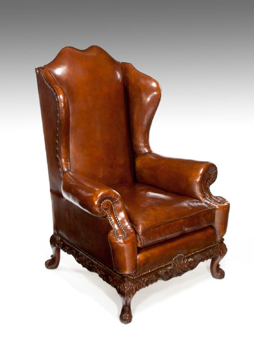 A Quality Walnut Leather Upholstered Wing Chair