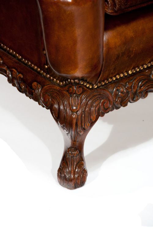fig 2. A Quality Walnut Leather Upholstered Wing Chair