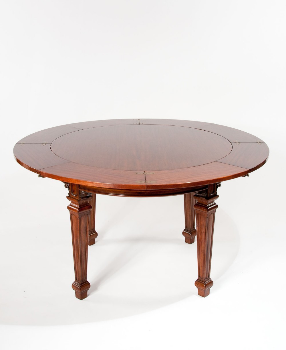 A Rare Jupe Extending Table Waring & Gillows