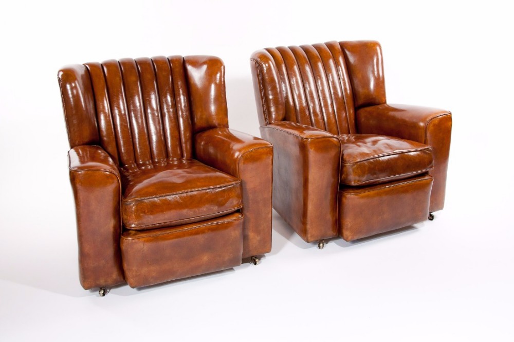 A SUPERB PAIR OF ART DECO LEATHER UPHOLSTERED CLUB CHAIRS