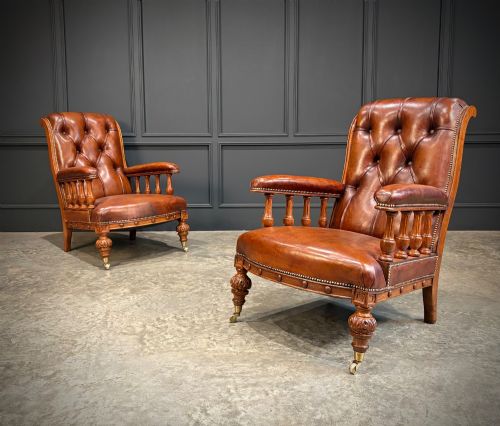 PAIR OF OAK BUTTONED LEATHER LIBRARY ARMCHAIRS