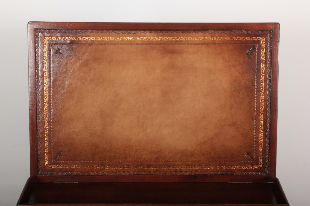 A Victorian flame mahogany Davenport desk featuring an inclined leather-lined writing slope, side drawers with turned wooden knobs, and a top stationery gallery. View XIII