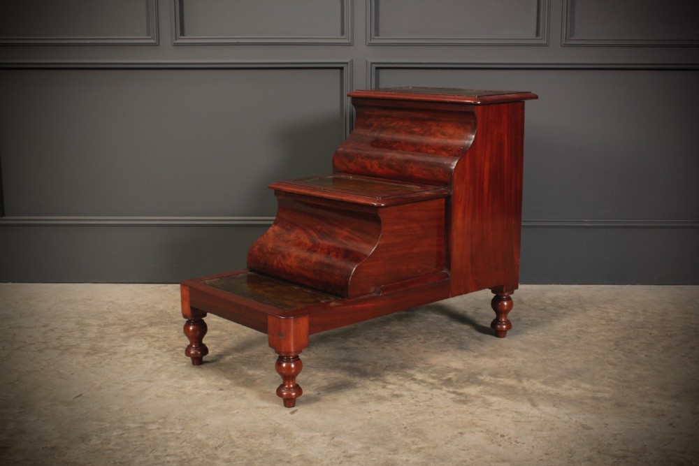 A three-tier Victorian mahogany library step unit featuring leather-lined treads and turned wooden feet. View VII