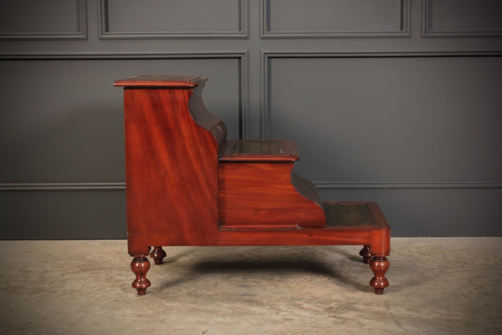 A three-tier Victorian mahogany library step unit featuring leather-lined treads and turned wooden feet. View XI