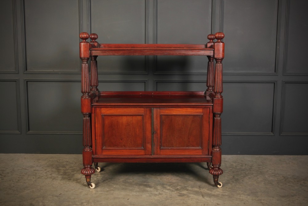 A Victorian mahogany two-tier buffet cabinet featuring turned reeded columns, a lower panelled cupboard, finials, and white castors. View III