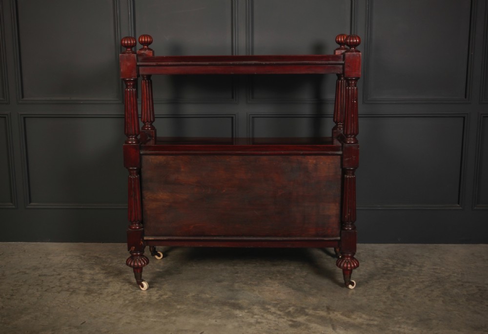 A Victorian mahogany two-tier buffet cabinet featuring turned reeded columns, a lower panelled cupboard, finials, and white castors. View XI
