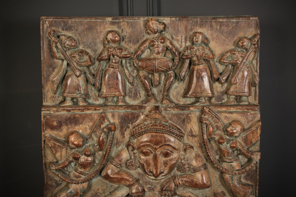 A tall, hand-carved Indian hardwood architectural panel depicting the deity Ganesha inside an arch with distressed dark stained timber. View VI
