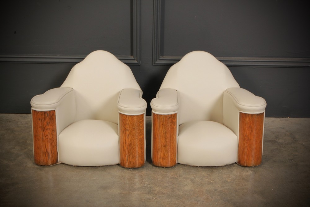 A miniature Art Deco three-piece suite featuring a small sofa and two matching armchairs upholstered in cream leather with polished curved wood arm fronts. View XIII
