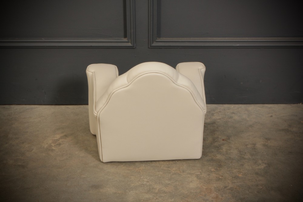 A miniature Art Deco three-piece suite featuring a small sofa and two matching armchairs upholstered in cream leather with polished curved wood arm fronts. View XVIII
