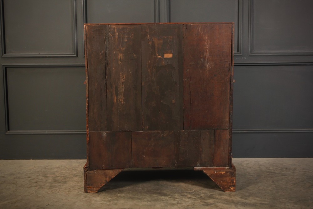 An eighteenth-century Queen Anne walnut slant-front bureau featuring brass drop handles, multiple drawers, and bracket feet. View VII