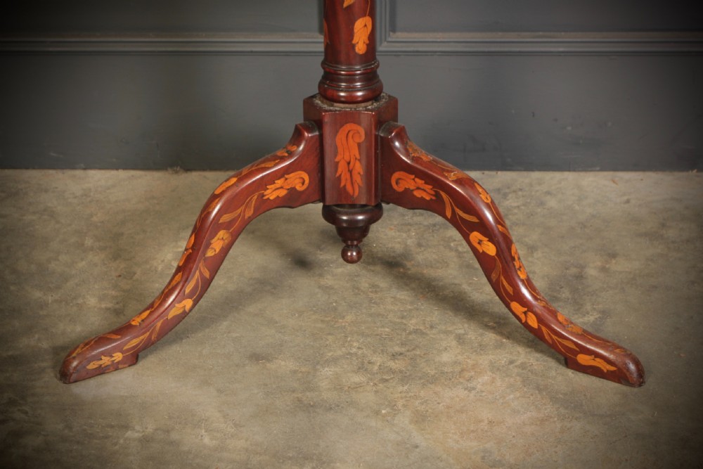 An 18th-century walnut three-tier dumb waiter featuring intricate floral marquetry inlay across three circular trays and a tripod base. View VI