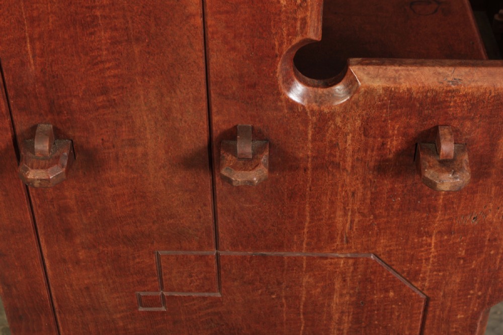 A nineteenth-century Gothic Revival elm dresser featuring an open shelf rack above two drawers and an open lower compartment with side quatrefoil cut-outs. View XII
