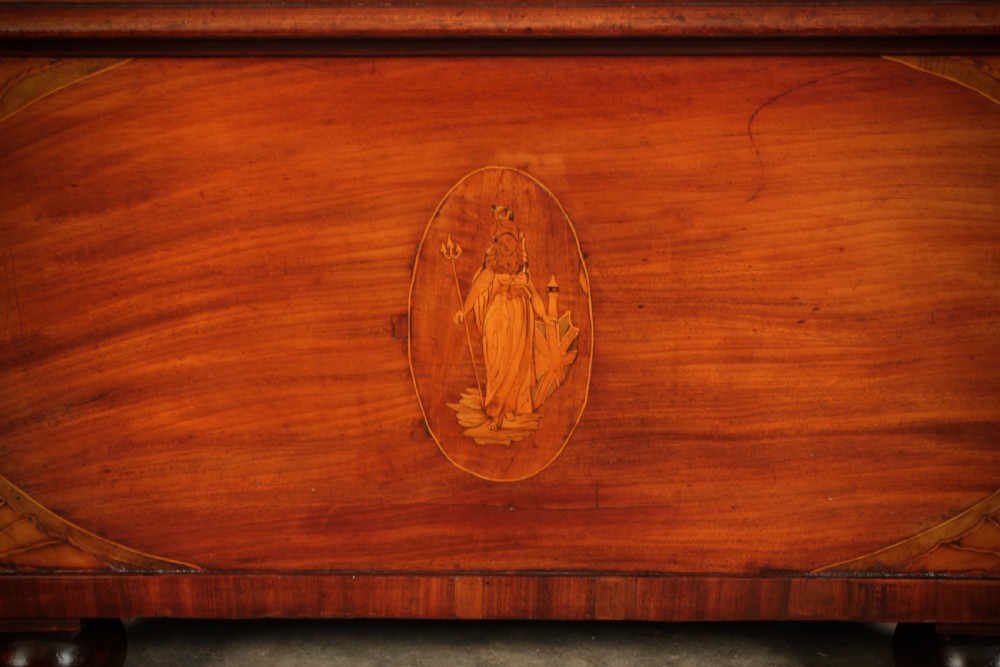 A tapered Georgian mahogany wine cooler with oval marquetry inlays raised on heavy bun feet. View VII