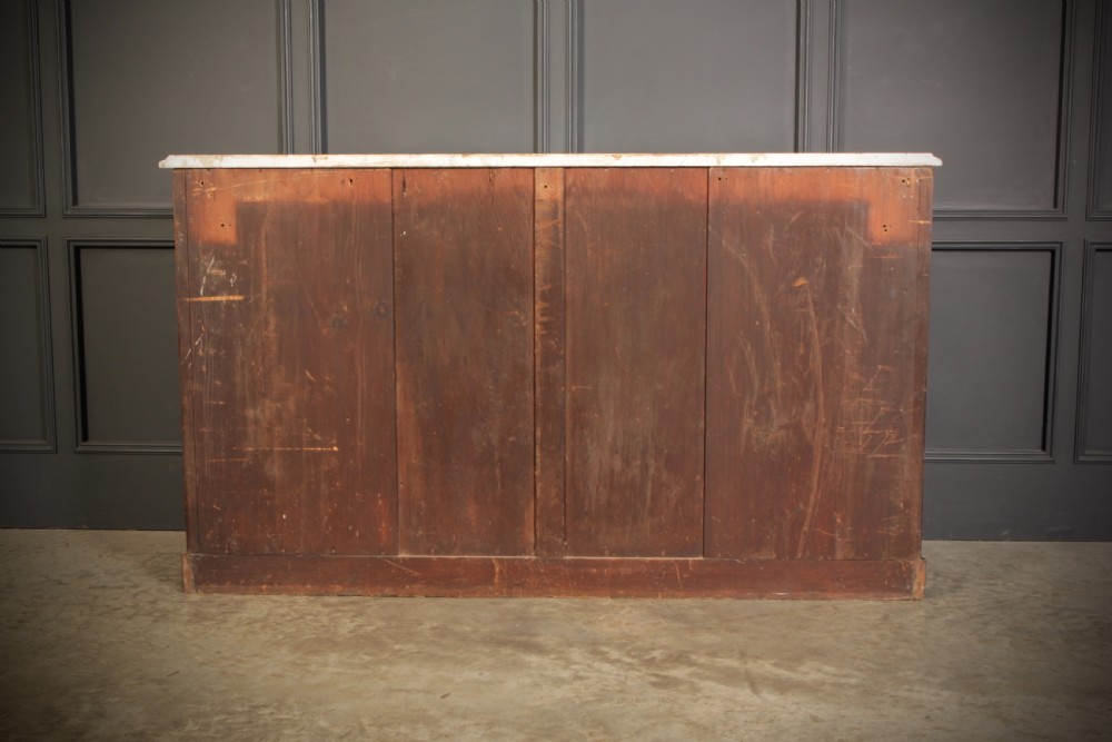 A Victorian burr walnut side cabinet featuring a white marble top, curved side shelves, and mirrored doors flanked by carved corbels. View XIII