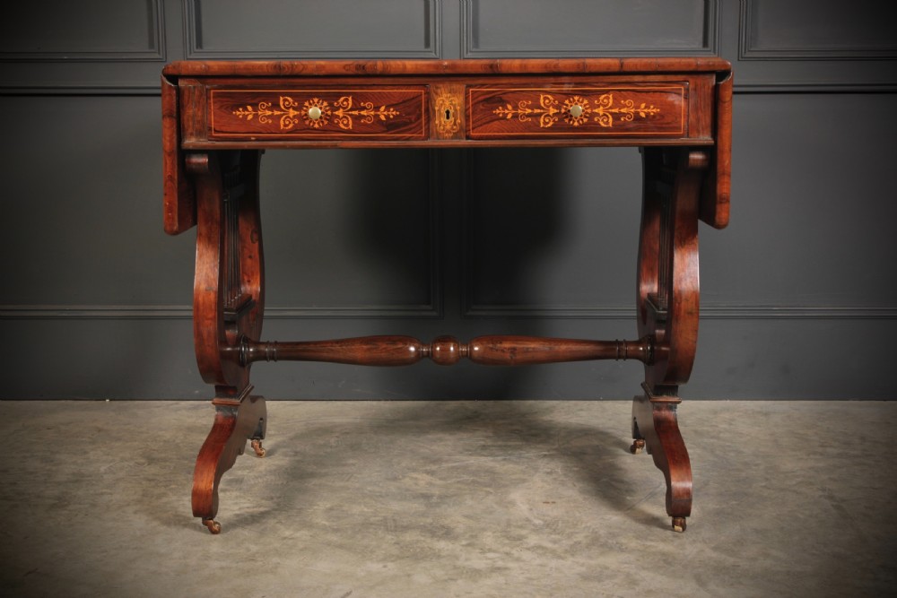 An antique dark brown rosewood sofa table featuring floral marquetry inlay, two drop leaves, twin drawers, and lyre trestle supports. View II
