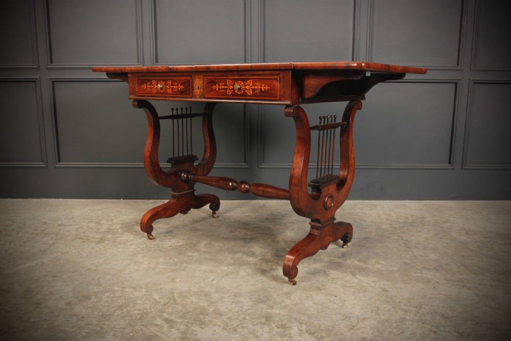 An antique dark brown rosewood sofa table featuring floral marquetry inlay, two drop leaves, twin drawers, and lyre trestle supports. View VIII