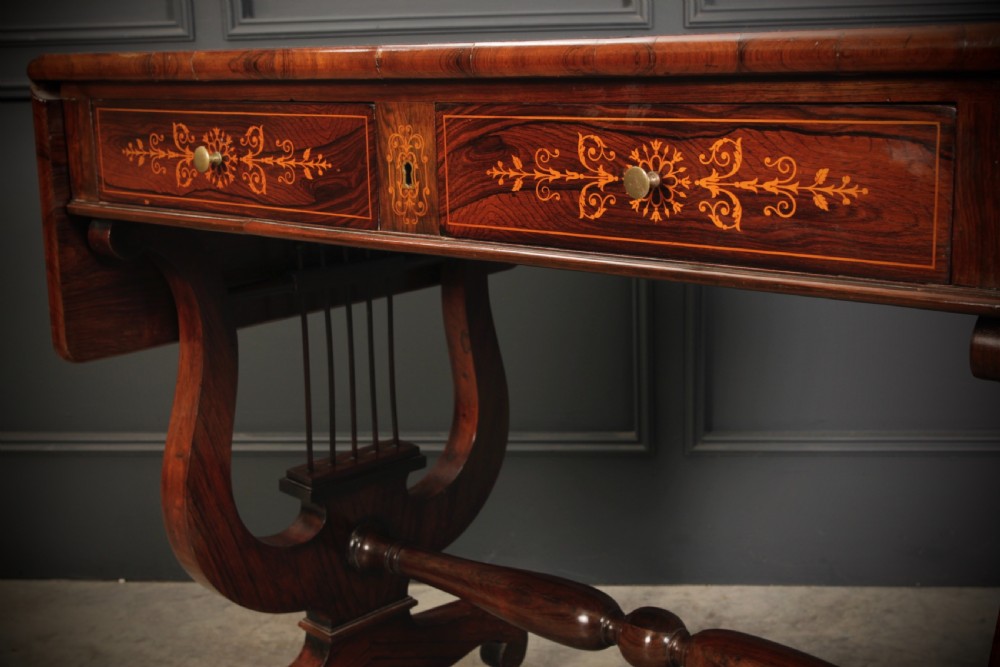 An antique dark brown rosewood sofa table featuring floral marquetry inlay, two drop leaves, twin drawers, and lyre trestle supports. View IX