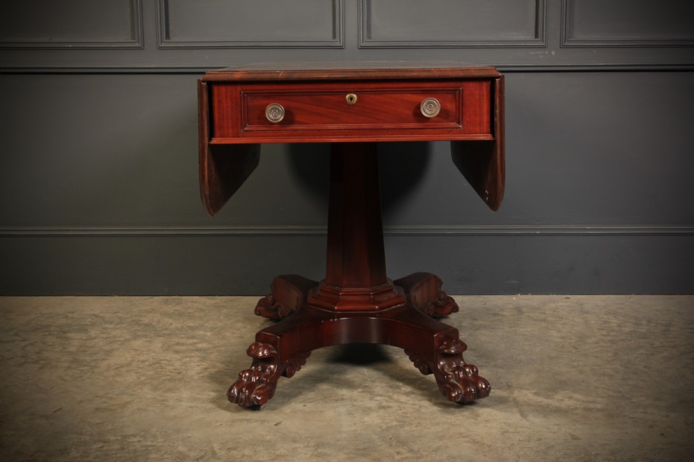 A William IV dark mahogany Pembroke table featuring two drop-down leaves, a single drawer with turned wooden knobs, a central pedestal, and a four-pointed base ending in carved claw feet. View XII