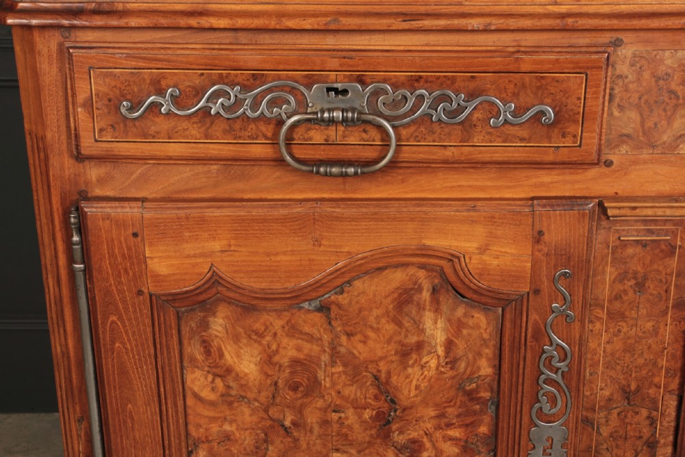 An 18th-century cherrywood and walnut dresser featuring an open tiered plate rack above a base unit with two drawers and two carved cupboard doors. View II
