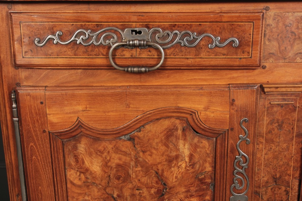An 18th-century cherrywood and walnut dresser featuring an open tiered plate rack above a base unit with two drawers and two carved cupboard doors. View III
