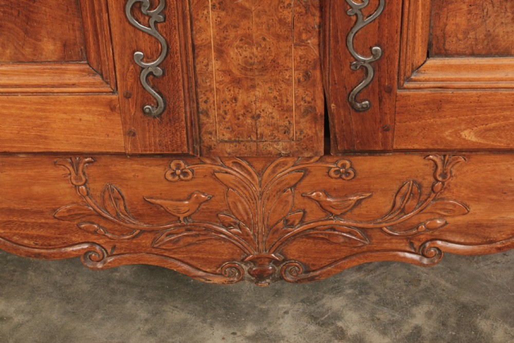 An 18th-century cherrywood and walnut dresser featuring an open tiered plate rack above a base unit with two drawers and two carved cupboard doors. View VI