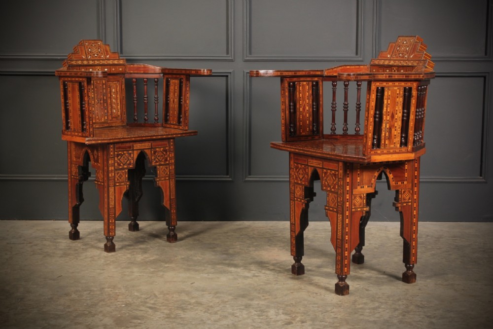 A pair of Syrian Moorish wooden armchairs featuring geometric bone and mother-of-pearl marquetry inlay and turned spindles. View II