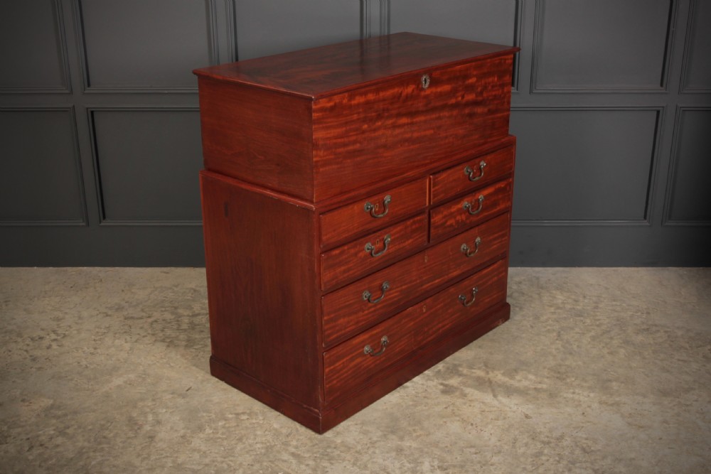A Georgian mahogany mule chest featuring a top hinged lid above four drawers with brass handles. View VI