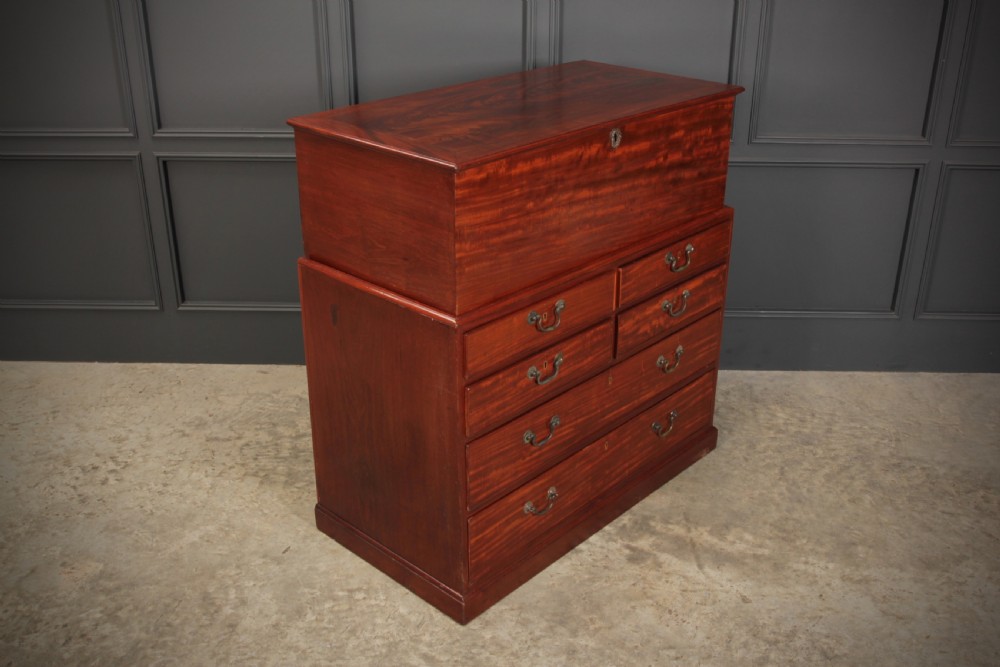 A Georgian mahogany mule chest featuring a top hinged lid above four drawers with brass handles. View III