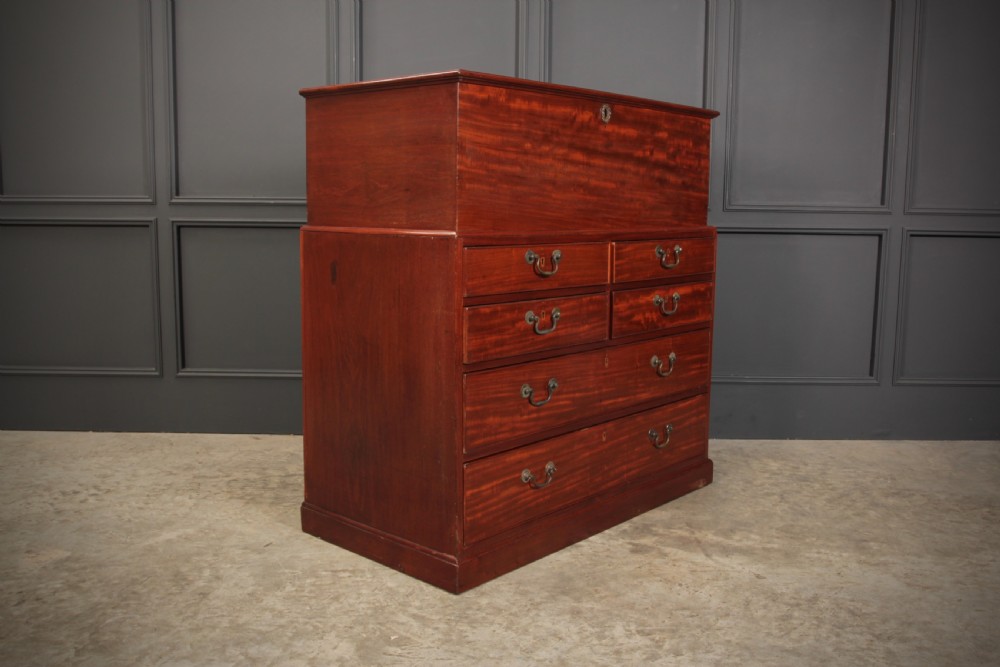 A Georgian mahogany mule chest featuring a top hinged lid above four drawers with brass handles. View VII
