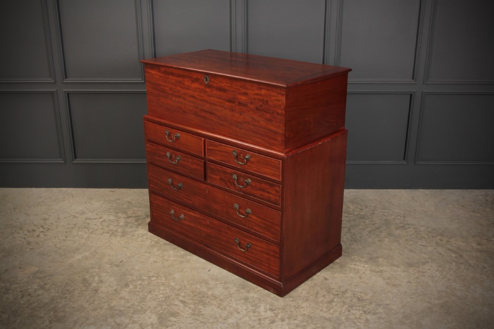 A Georgian mahogany mule chest featuring a top hinged lid above four drawers with brass handles. View IX