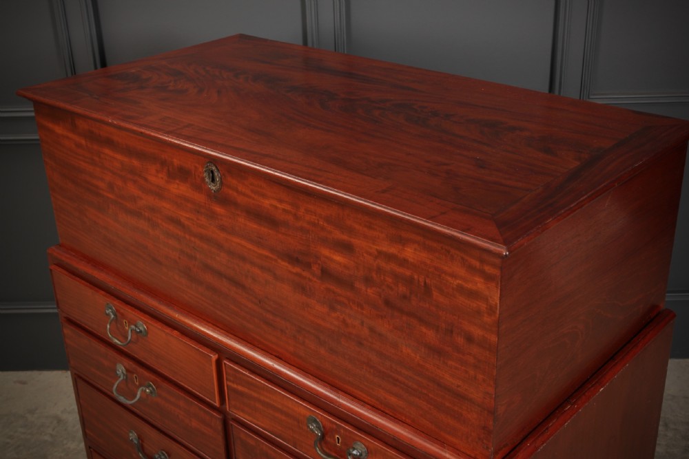 A Georgian mahogany mule chest featuring a top hinged lid above four drawers with brass handles. View X