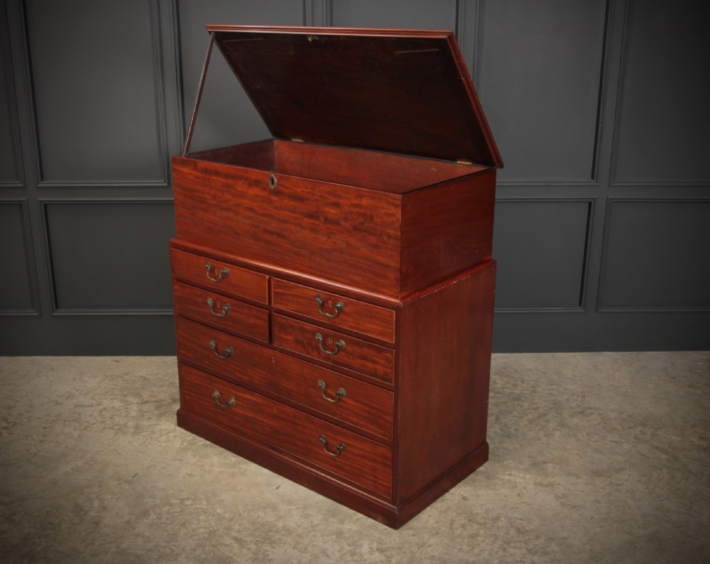 A Georgian mahogany mule chest featuring a top hinged lid above four drawers with brass handles. View XI