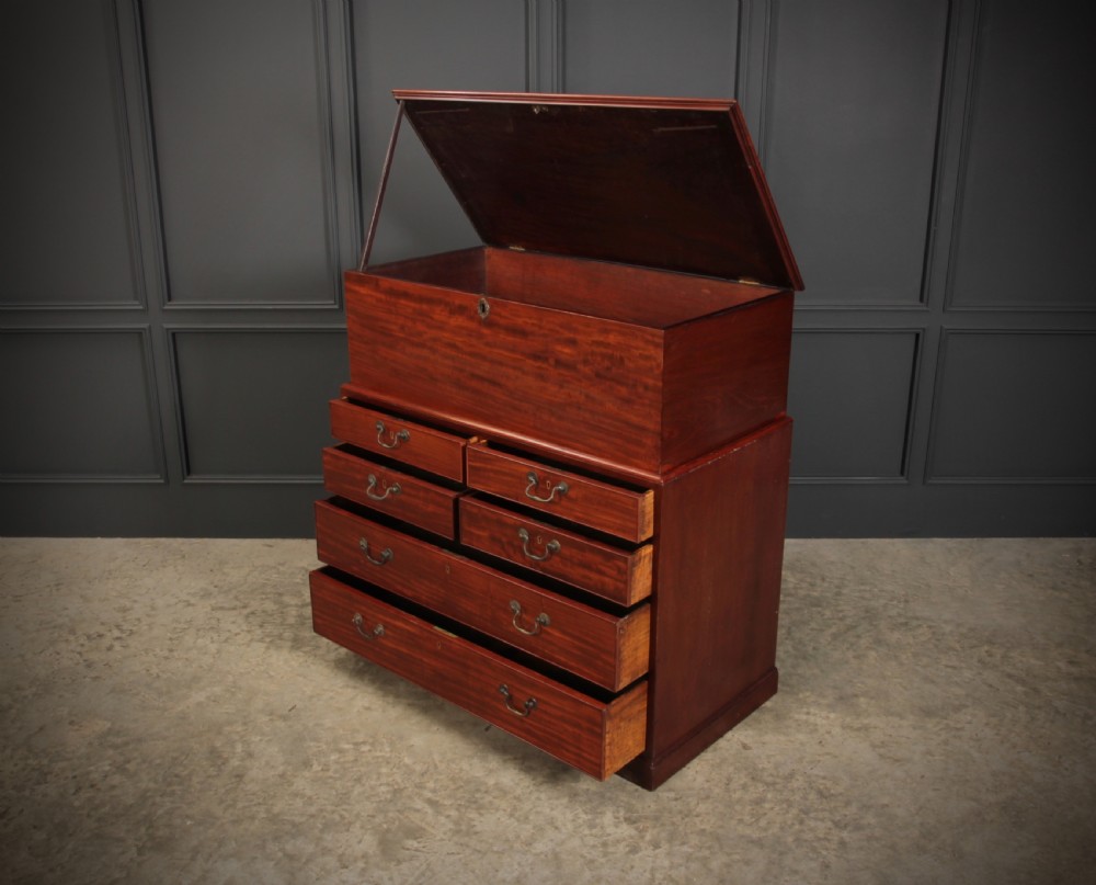A Georgian mahogany mule chest featuring a top hinged lid above four drawers with brass handles. View XII
