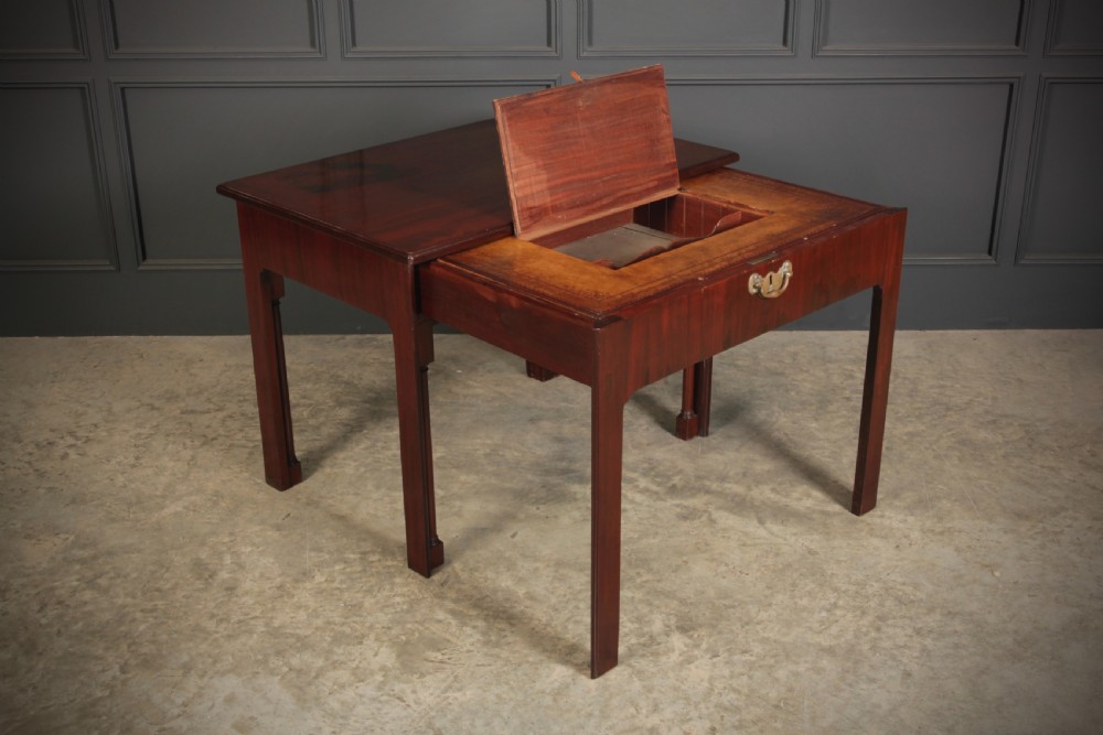 A Georgian mahogany architects table featuring a sliding front drawer with an inlaid leather writing top and square support legs. View IV