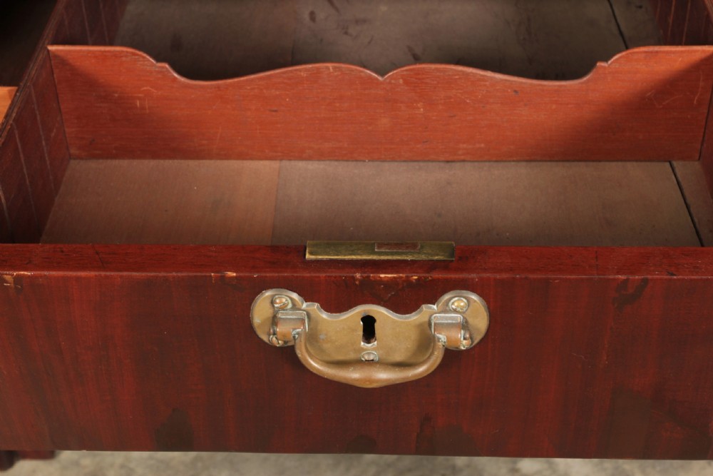 A Georgian mahogany architects table featuring a sliding front drawer with an inlaid leather writing top and square support legs. View VII