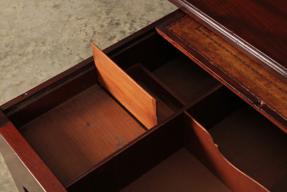 A Georgian mahogany architects table featuring a sliding front drawer with an inlaid leather writing top and square support legs. View VIII