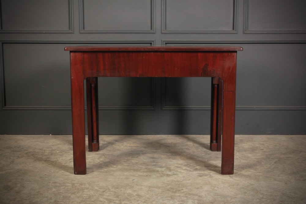 A Georgian mahogany architects table featuring a sliding front drawer with an inlaid leather writing top and square support legs. View XIV