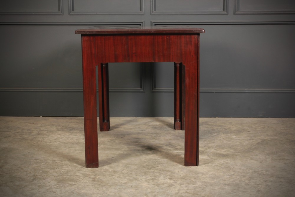 A Georgian mahogany architects table featuring a sliding front drawer with an inlaid leather writing top and square support legs. View XV