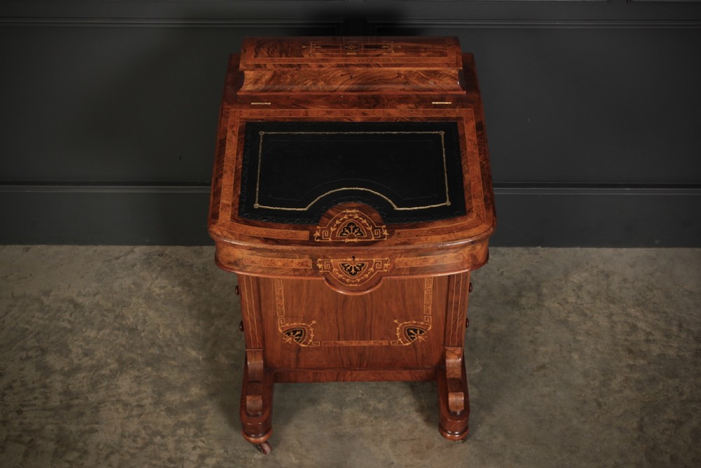 A 19th-century Victorian walnut Davenport desk featuring a sloped leather writing surface, side drawers with wooden knobs, and floral marquetry inlays. View XI