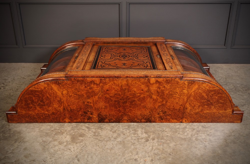 A nineteenth-century Victorian credenza made from burr walnut featuring central floral marquetry, curved glazed side display doors, and polished metal mounts. View XI