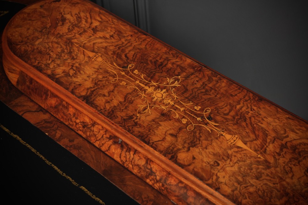 A Victorian burr walnut kidney-shaped writing table featuring a black leather insert, inlaid marquetry, raised caddy, frieze drawers, and carved legs on castors. View XI